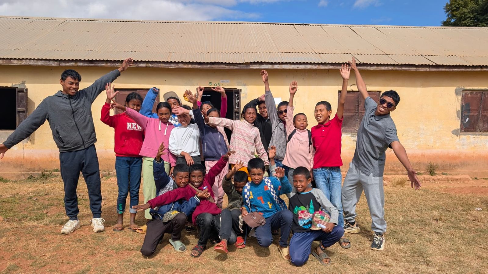 The 2026 group cheering outside the school building
